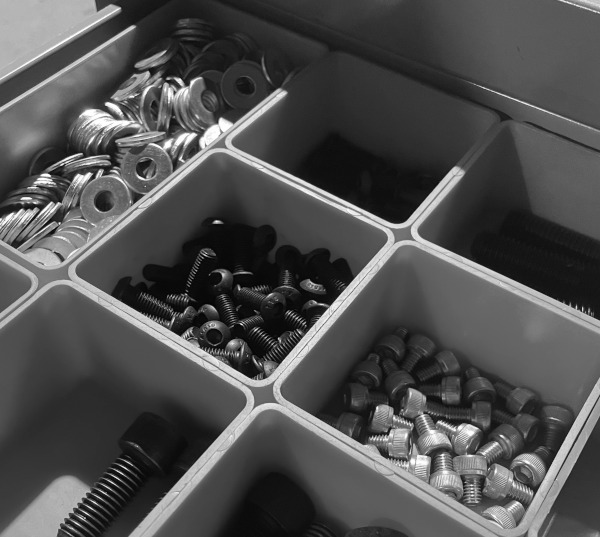 Fasteners in kitting bins.