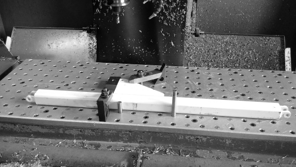 Linkage being machined on CNC mill.
